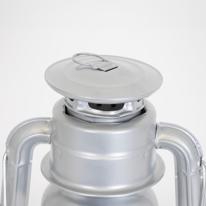 Close-up of the top vent and cap on a handcrafted silver metal lantern with a weather-resistant finish, designed for dependable lighting in Farm, Garden & Tool, Camping, and Emergency Supplies collections.