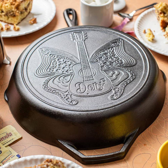 Cast iron skillet featuring a butterfly and guitar design with "Dolly" inscription, handcrafted in USA, ideal for Kitchen & Food, Cookware, Cast Iron, Best Sellers, and Promo Eligible collections.
