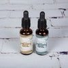 Two unique handcrafted amber glass bottles of locally-made beard oil with dropper caps, featuring natural ingredients, shown for Grooming and Personal Hygiene, Health & Wellness, and USA Made collections.