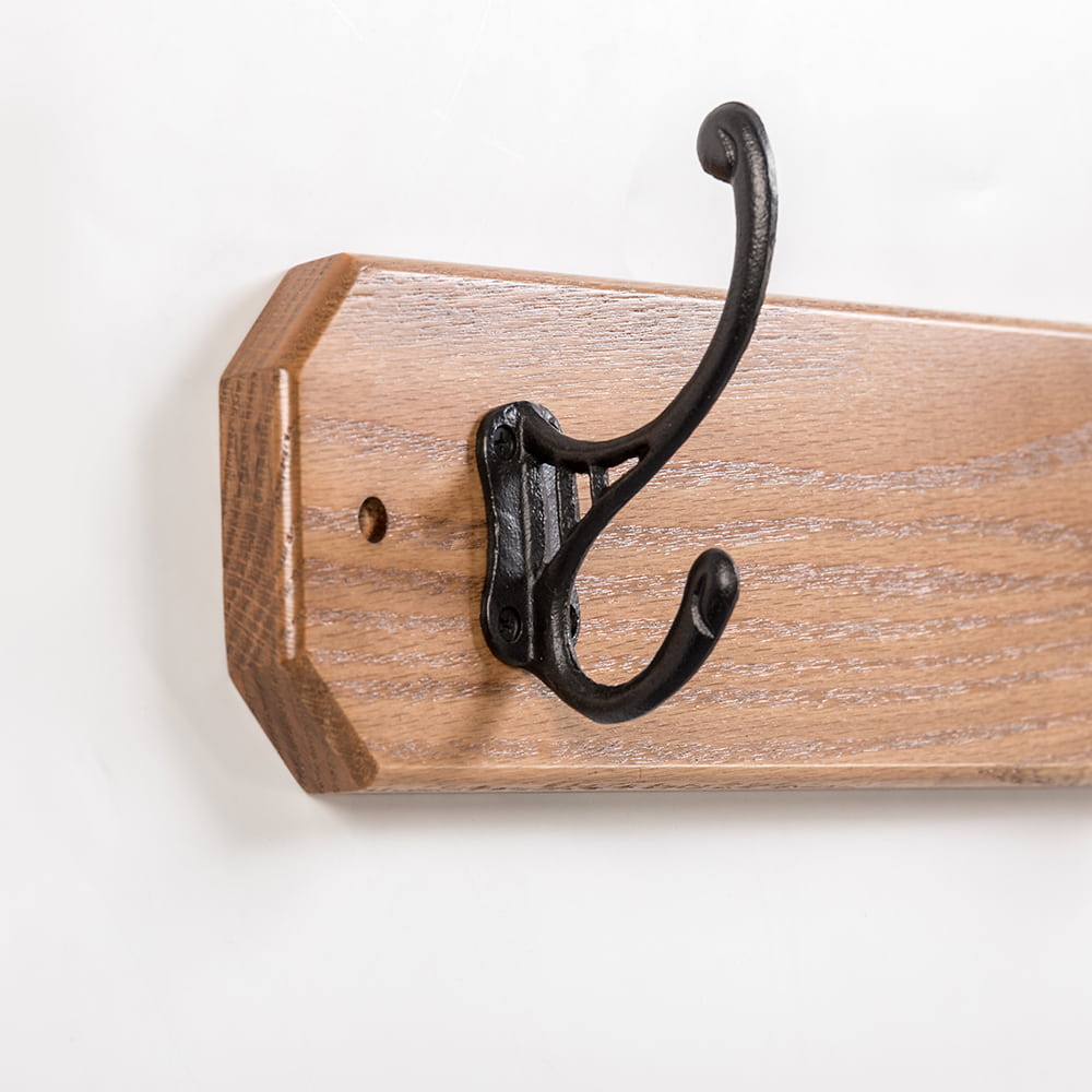 Handcrafted oak wallboard with a single black metal double hook, Amish made in the USA, perfect for organizing coats, featured in Home & Decor, Household Helpers, and Best Sellers collections.