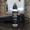 Small bottle of natural stainless steel polish and cleaner with black and white label, designed to remove fingerprints and smudges, featured in Home & Decor and Household Cleaning collections.