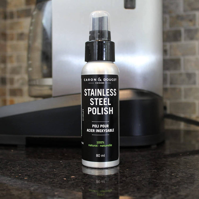 Small bottle of natural stainless steel polish and cleaner with black and white label, designed to remove fingerprints and smudges, featured in Home & Decor and Household Cleaning collections.