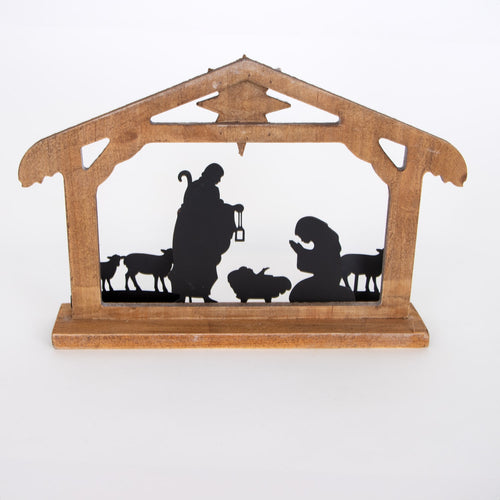 Wooden nativity display with metal silhouettes of the Holy Family and animals in a weathered stable, featuring a vintage style for Home & Decor and Holiday collections.
