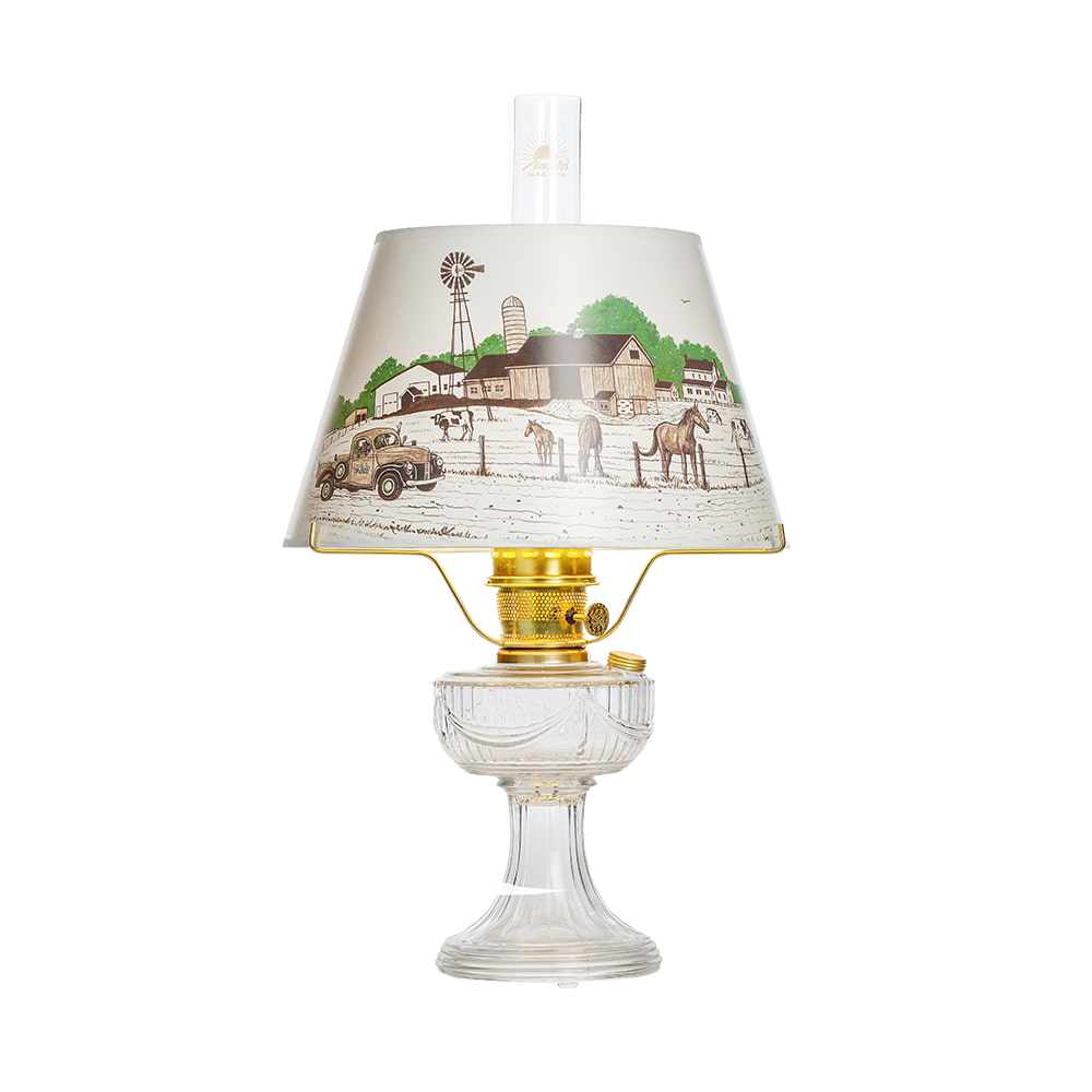 Handcrafted clear glass oil lamp with brass burner and decorative Lincoln Drape shade featuring a vintage farm scene, part of Lamps & Lighting, Oil Lamps, Table Lamps, Best Sellers, and Promo Eligible collections.