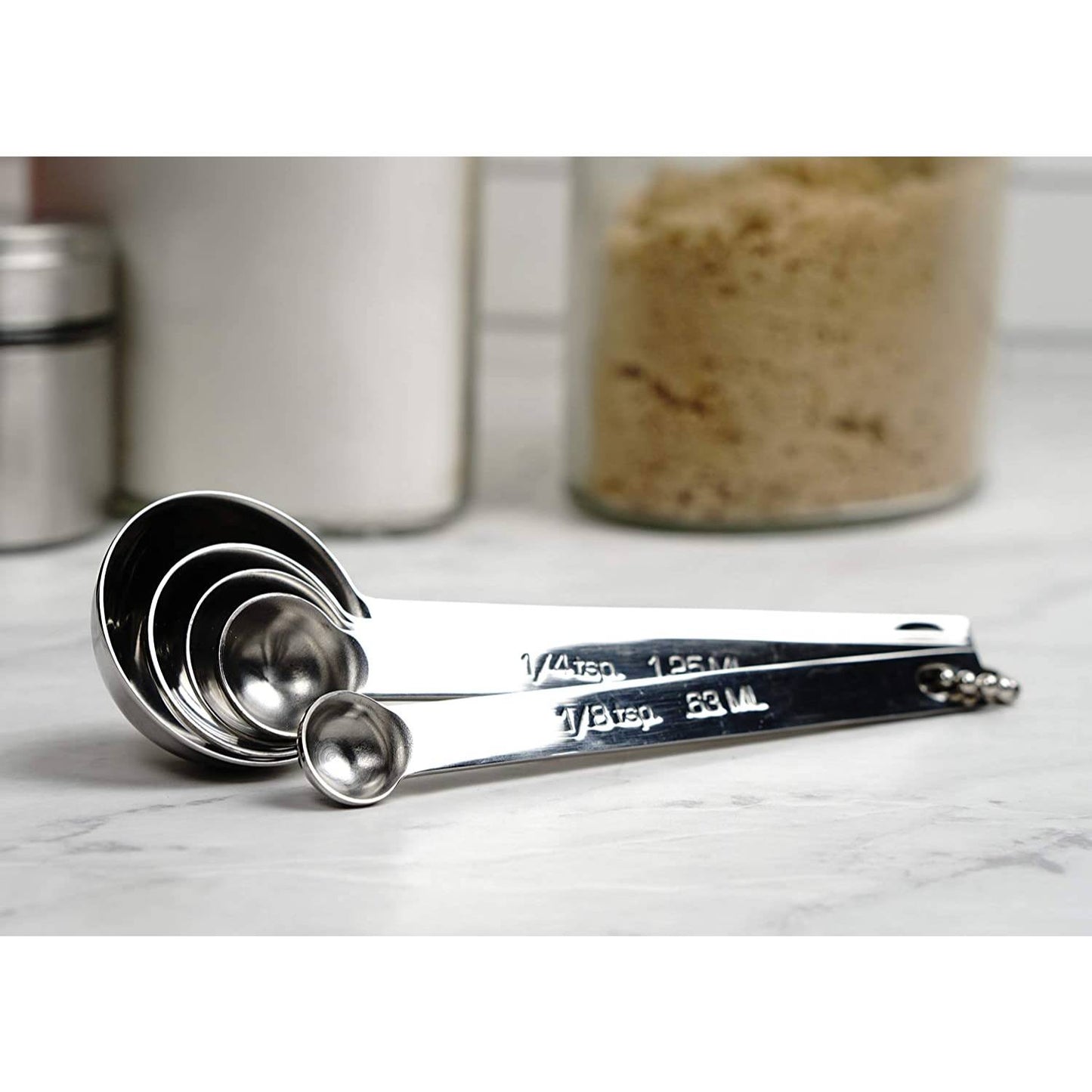 Set of five durable stainless steel measuring spoons linked together on a small ring, perfect for Kitchen & Food, Food Prep, Measuring, Best Sellers, and Promo Eligible collections.