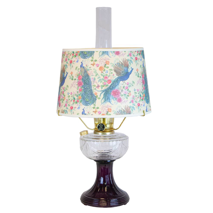 Handcrafted amethyst glass oil lamp featuring a clear glass font and a decorative peacock-patterned shade, part of Lamps & Lighting, Oil Lamps, and Table Lamps collections.