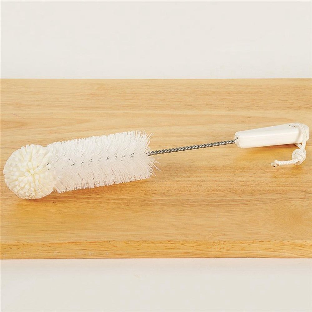 Cleaning brush with white foam tip, twisted wire handle, and a white plastic grip with hanging loop, suitable for household cleaning and USA made collections