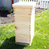 Handcrafted Amish-made 8-frame wooden beehive kit with multiple stacked boxes and white telescoping cover, set on green lawn, suitable for beekeeping, farm, and garden use.