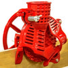 Handcrafted cast iron corn sheller in bright red with a large flywheel pulley clamped to a wooden surface, featured in Farm, Garden & Tool, Farm Tools, and Best Sellers collections.