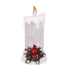 Handcrafted lighted decorative candle with glittering body, topped with a glowing flame and adorned with a red cardinal, holly leaves, and pinecones, perfect for Home & Decor, Holiday Decor, Best Sellers, and Promo Eligible collections.