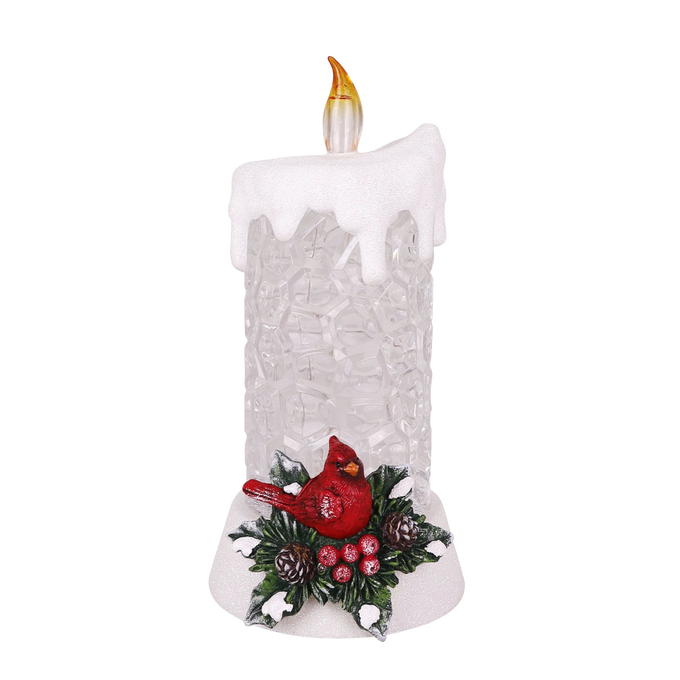 Handcrafted lighted decorative candle with glittering body, topped with a glowing flame and adorned with a red cardinal, holly leaves, and pinecones, perfect for Home & Decor, Holiday Decor, Best Sellers, and Promo Eligible collections.