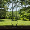 Tall clear glass oil lamp chimney with a distinctive rounded bulge near the base, designed for Lamps & Lighting and Parts and Accessories collections, featured in Best Sellers and Promo Eligible.