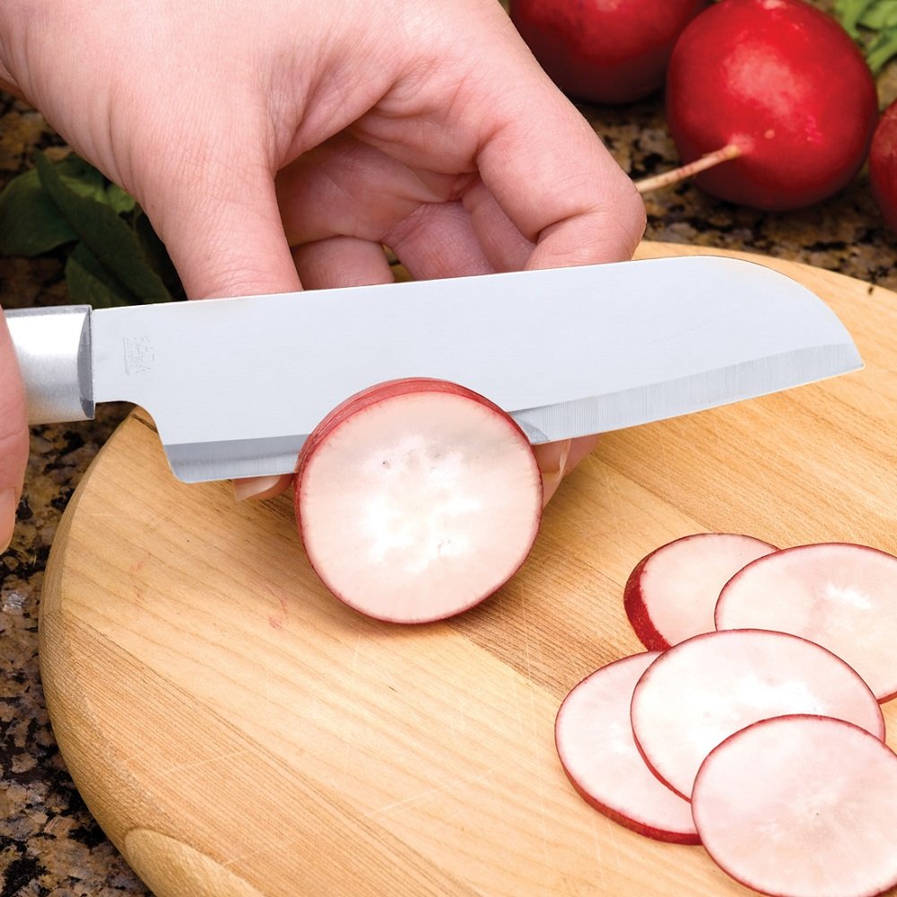 Handcrafted utility knife with a sharp stainless steel blade slicing radishes on a wooden cutting board, ideal for food prep in kitchen, farm, and garden settings.