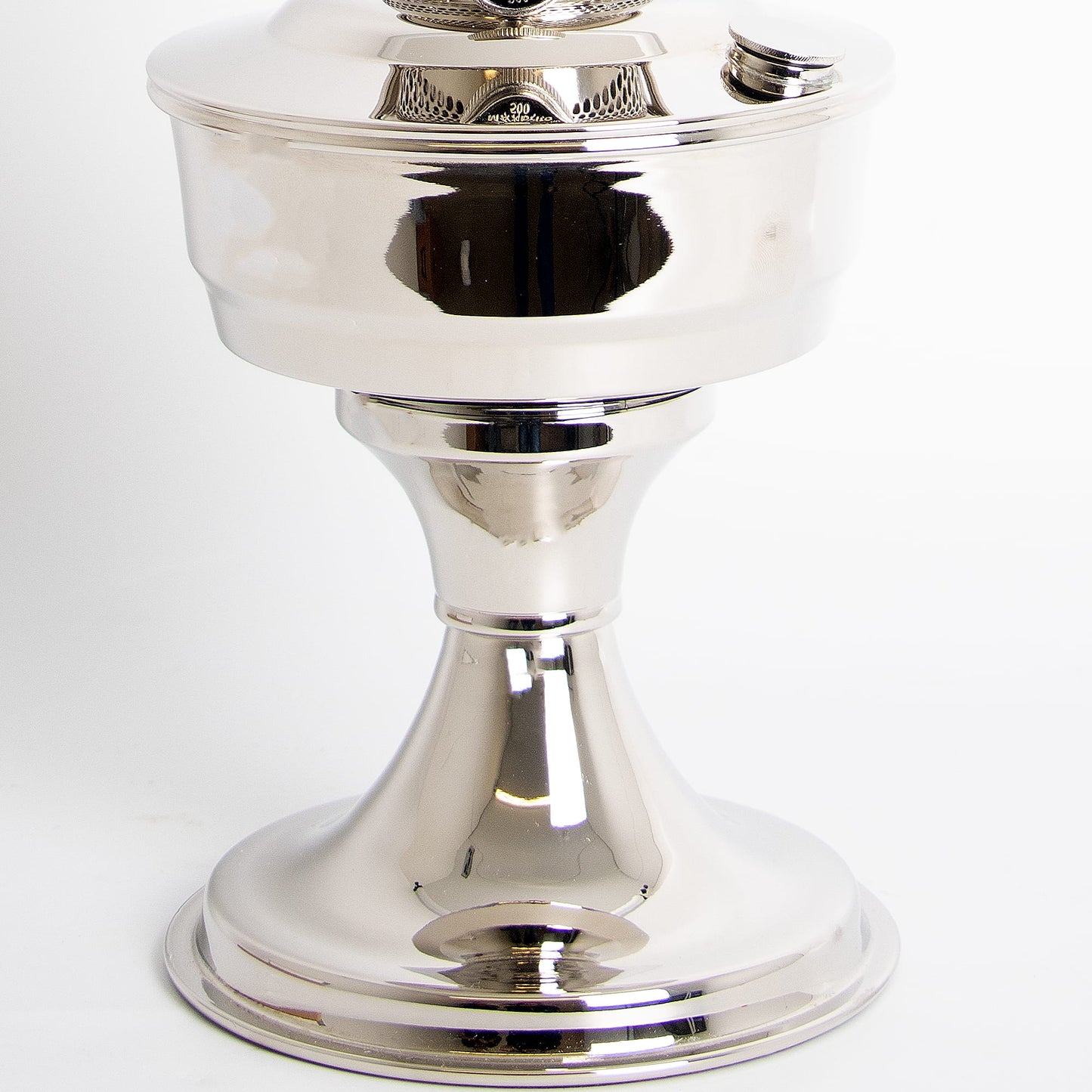 Close-up of a handcrafted chrome-plated oil lamp base with a polished, reflective surface, part of Lamps & Lighting, Oil Lamps, and Best Sellers collections.