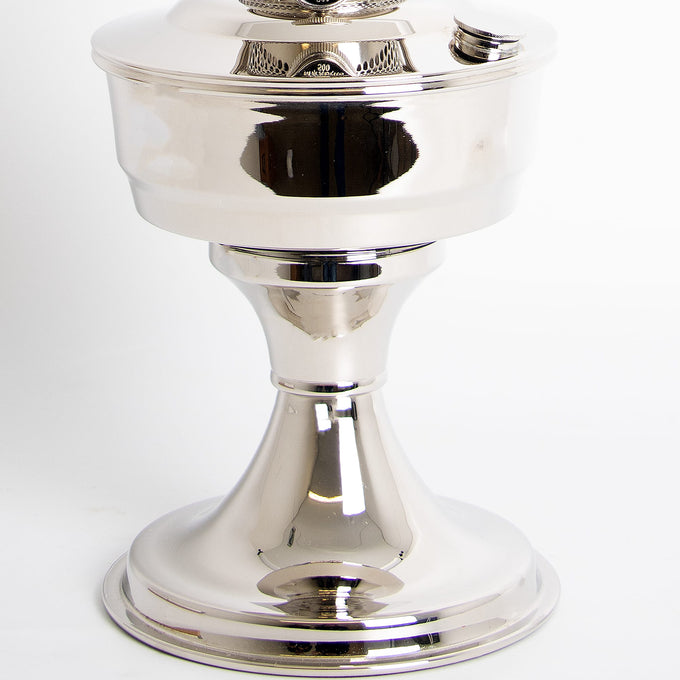 Close-up of a handcrafted chrome-plated oil lamp base with a polished, reflective surface, part of Lamps & Lighting, Oil Lamps, and Best Sellers collections.