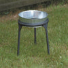Sturdy three-legged stand crafted for holding kettles over open flames, featuring heavy steel construction and suitable for outdoor camping, cookware, and garden use with a clearance for pots.