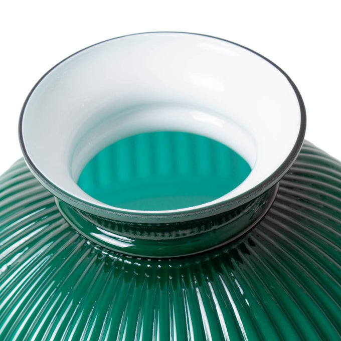 Close-up of a handcrafted green ribbed glass oil lamp shade with a smooth white enamel rim, adding a warm, diffused glow and rustic charm to Farm, Garden & Tool and Lamps & Lighting collections.