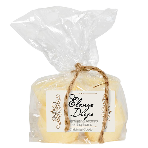 Clear cellophane bag tied with rustic twine, containing six pale yellow scented wax drops labeled with elegant script for uplifting Christmas Cookie aromas, ideal for Home & Decor, Decor, Best Sellers, Promo Eligible, and Sale collections.