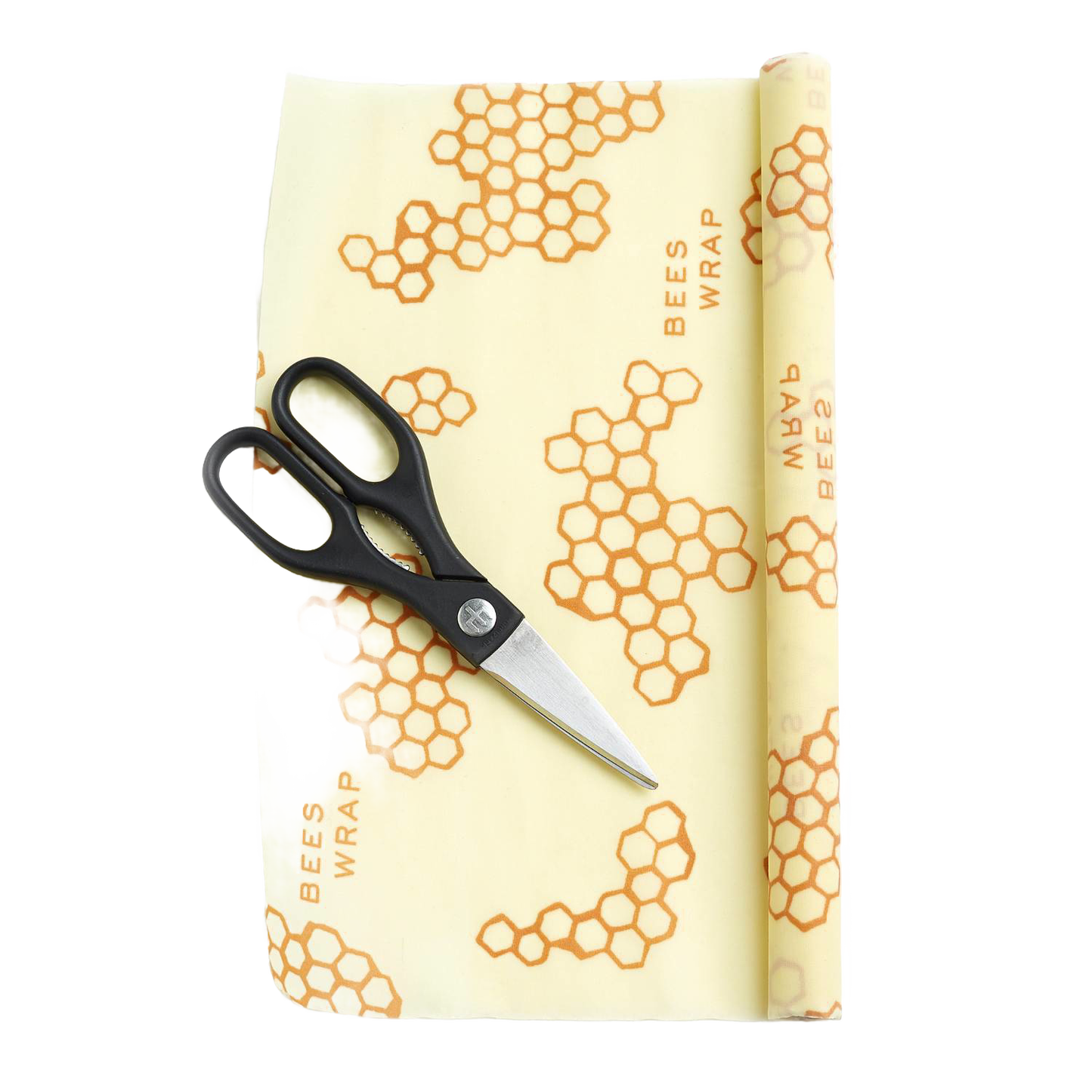 Partially unrolled beeswax food wrap with honeycomb pattern and printed text, accompanied by black-handled scissors, handcrafted in the USA for Kitchen & Food and Storage and Serving collections.
