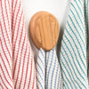 Handcrafted oak towel holder with a smooth finish and built-in marble, hanging striped kitchen towels, part of Home & Decor, Household Helpers, USA Made, and Amish Made collections.