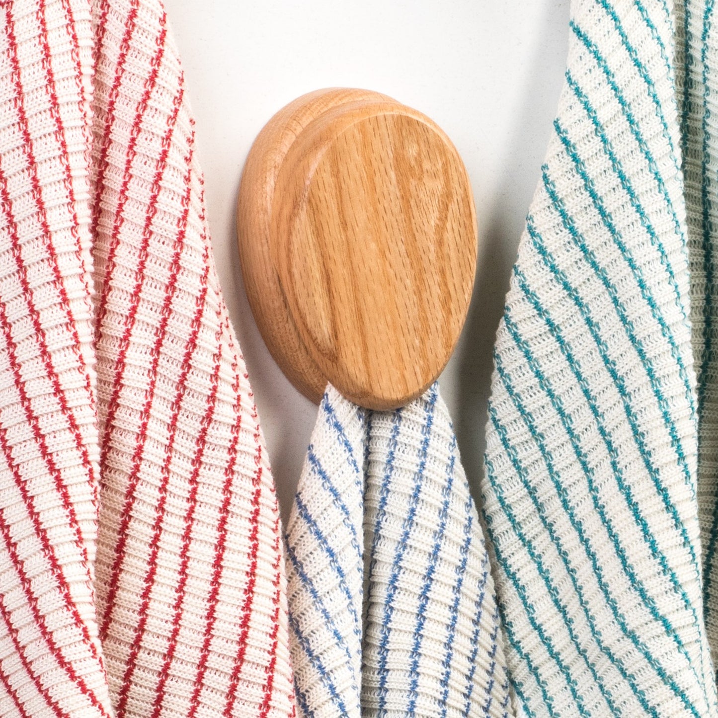 Handcrafted oak towel holder with a smooth finish and built-in marble, hanging striped kitchen towels, part of Home & Decor, Household Helpers, USA Made, and Amish Made collections.