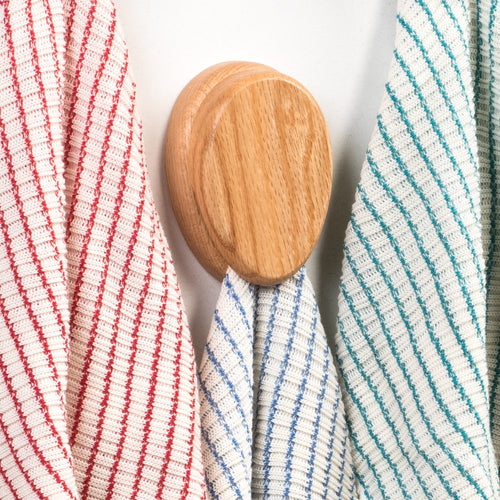 Handcrafted oak towel holder with a smooth finish and built-in marble, hanging striped kitchen towels, part of Home & Decor, Household Helpers, USA Made, and Amish Made collections.