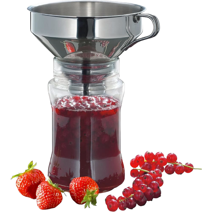 Wide-mouth stainless steel funnel with removable fine mesh filter inserted into a glass jar, surrounded by fresh strawberries and red currants, ideal for kitchen and food preservation tasks