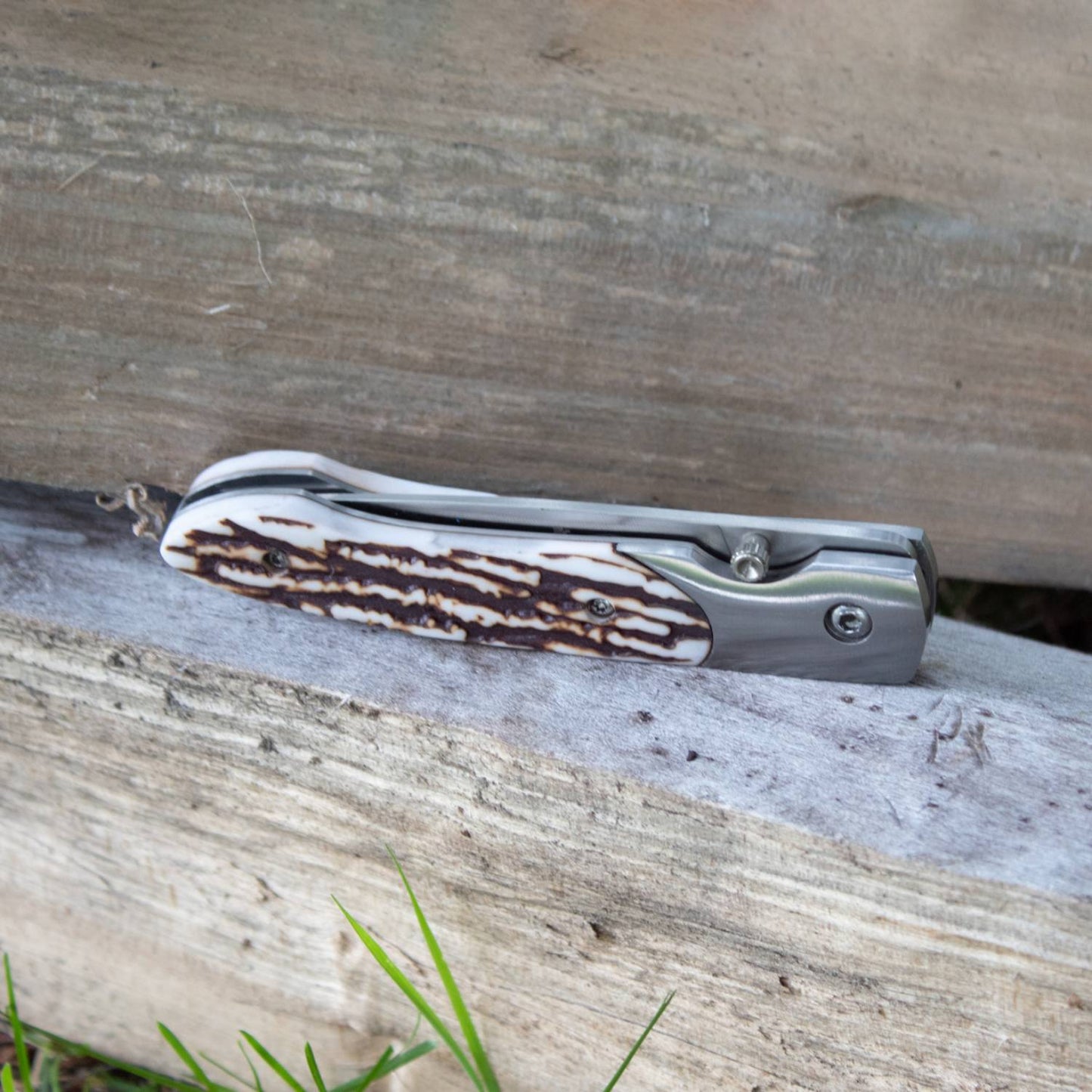 Compact folding knife featuring a textured antler handle and stainless steel blade, designed for durability and everyday utility, part of Farm, Garden & Tool and Pocket Knives collections.