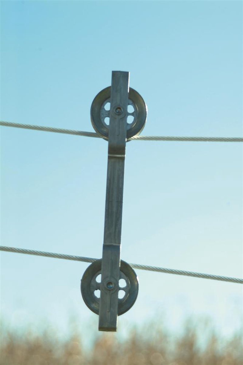 Cast aluminum clothesline spacer with dual pulleys holding parallel clotheslines against a clear blue sky, designed for Home & Decor, Laundry Supplies, and Drying Accessories collections.