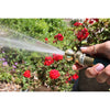 Handheld brass garden hose nozzle delivering a strong, efficient water stream to vibrant red flowers, featured in Farm, Garden & Tool, Garden Accessories, Lawncare, USA Made, and Best Sellers collections.
