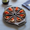 Cast iron wedge pan with eight sections, naturally seasoned with vegetable oil, featuring a dual handle design, presented with chocolate wedges topped with whipped cream and fresh strawberries, ideal for Kitchen & Food, Cookware, Cast Iron, USA Made, Best Sellers, and Promo Eligible collections.