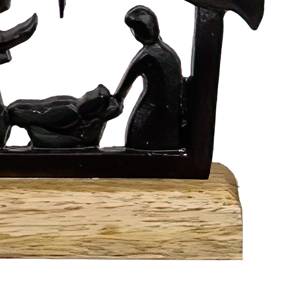 Handcrafted cast iron nativity scene featuring the Holy Family silhouette on a natural wooden base, designed for Holiday Decor, Home & Decor, Best Sellers, and Promo Eligible collections.