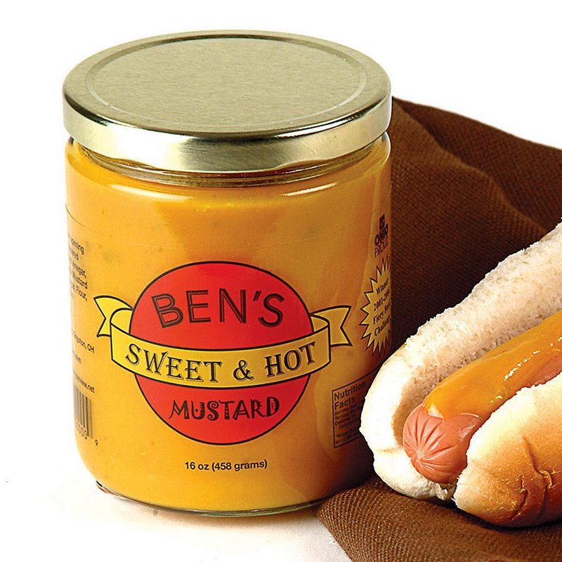Glass jar of handcrafted sweet and spicy mustard beside a hot dog on a brown cloth, perfect for Kitchen & Food, Pantry, USA Made, and Best Sellers collections.