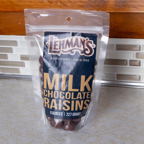Resealable clear pouch of handcrafted milk chocolate covered raisins by Lehman’s, made in USA, perfect for snacking from Kitchen & Food, Snacks and Sweets, Candy, USA Made, and Best Sellers collections.
