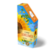 Brightly colored puzzle box shaped like a sunflower with floral design and scattered puzzle pieces, featuring a unique 350-piece sunflower-shaped jigsaw puzzle in Toys, Books & Games collections.