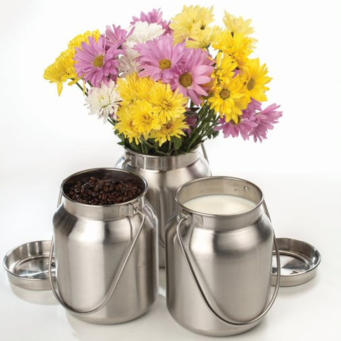 Set of handcrafted stainless steel milk cans with a brushed finish, featuring welded bail tabs; one filled with colorful flowers, another with coffee beans, and one with milk, styled for Home & Decor, Farm, Garden & Tool, Animal Care, and Best Sellers collections.