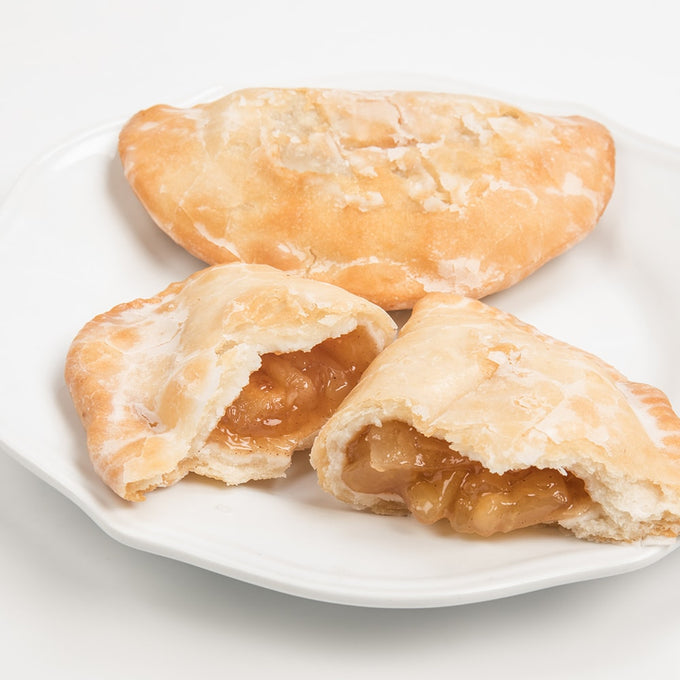 Handcrafted Amish-style fry pies with thick golden crusts and warm apple filling served on a white plate, perfect for Kitchen & Food, Snacks and Sweets, USA Made, and Best Sellers collections.