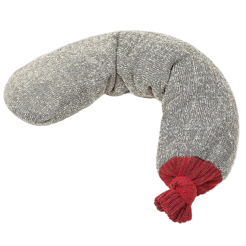 Soft grey fabric hot pack filled with ground black walnut shells, featuring a red knit end, handcrafted in the USA, ideal for natural health remedies and wellness use.
