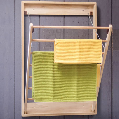 Handcrafted wooden wall-mounted drying rack with seven dowels and metal chains, featuring two colorful textured towels, part of Home & Decor, Laundry Supplies, and Amish Made collections.