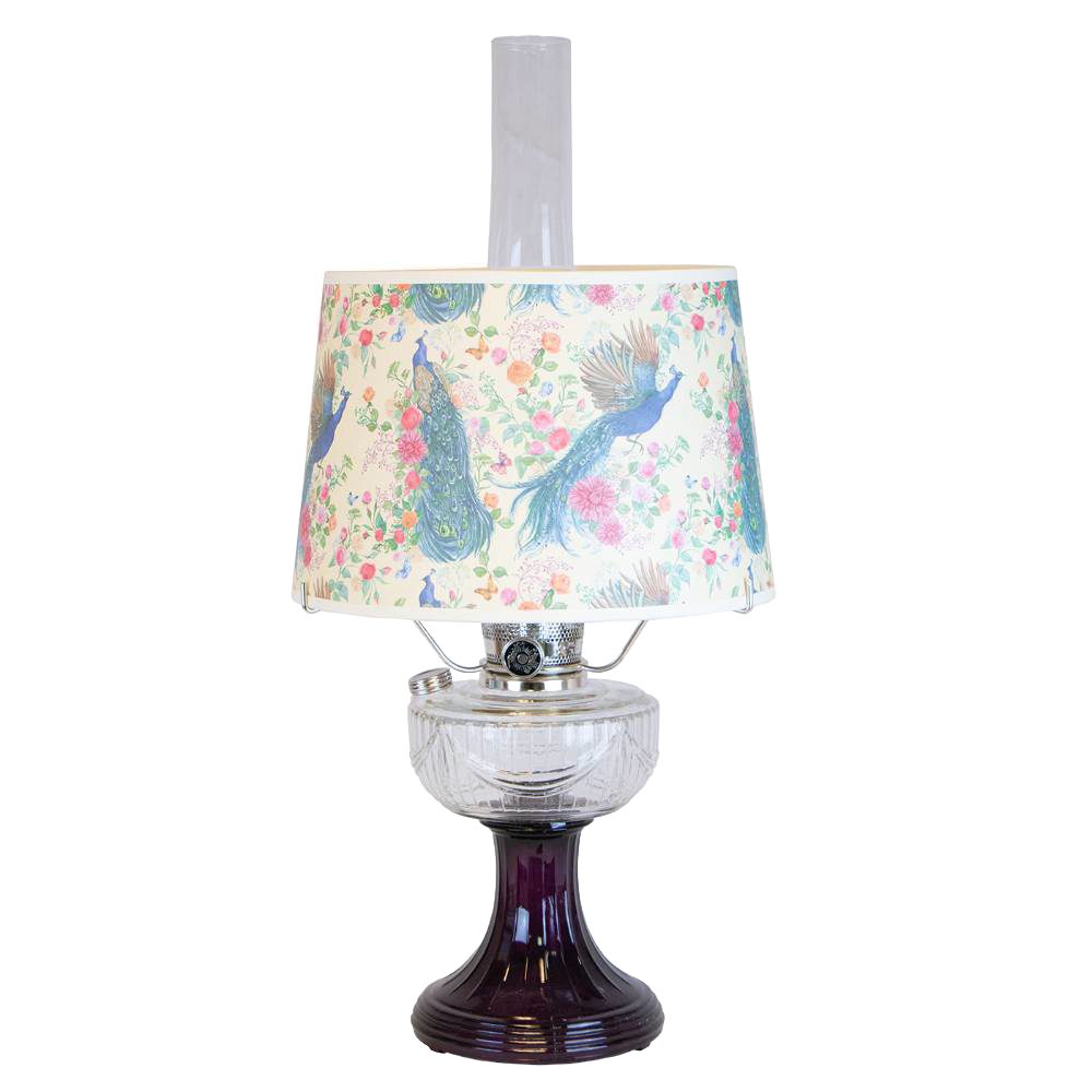 Handcrafted oil lamp featuring a clear glass font over an amethyst pedestal base with a decorative peacock-patterned shade, part of Lamps & Lighting, Oil Lamps, and Best Sellers collections.
