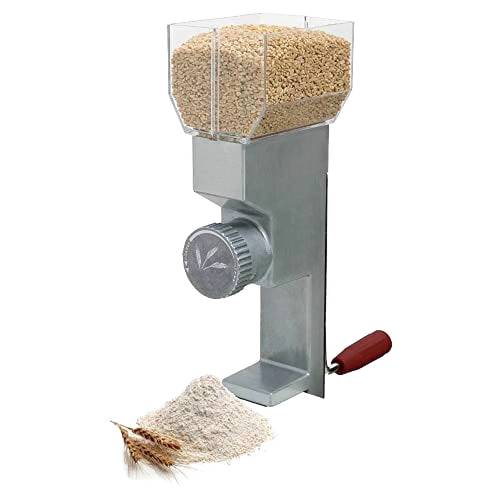 Compact grain mill with adjustable front dial and stainless steel burrs, featuring a wooden handle and clear hopper filled with grain, shown with fresh flour and wheat stalks, ideal for Kitchen & Food and Bread Making Supplies collections.