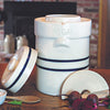 Handcrafted 3-gallon natural stoneware fermenting crock with classic blue stripes and a built-in water-sealed gutter, ideal for food preservation and homesteading in USA-made collections.