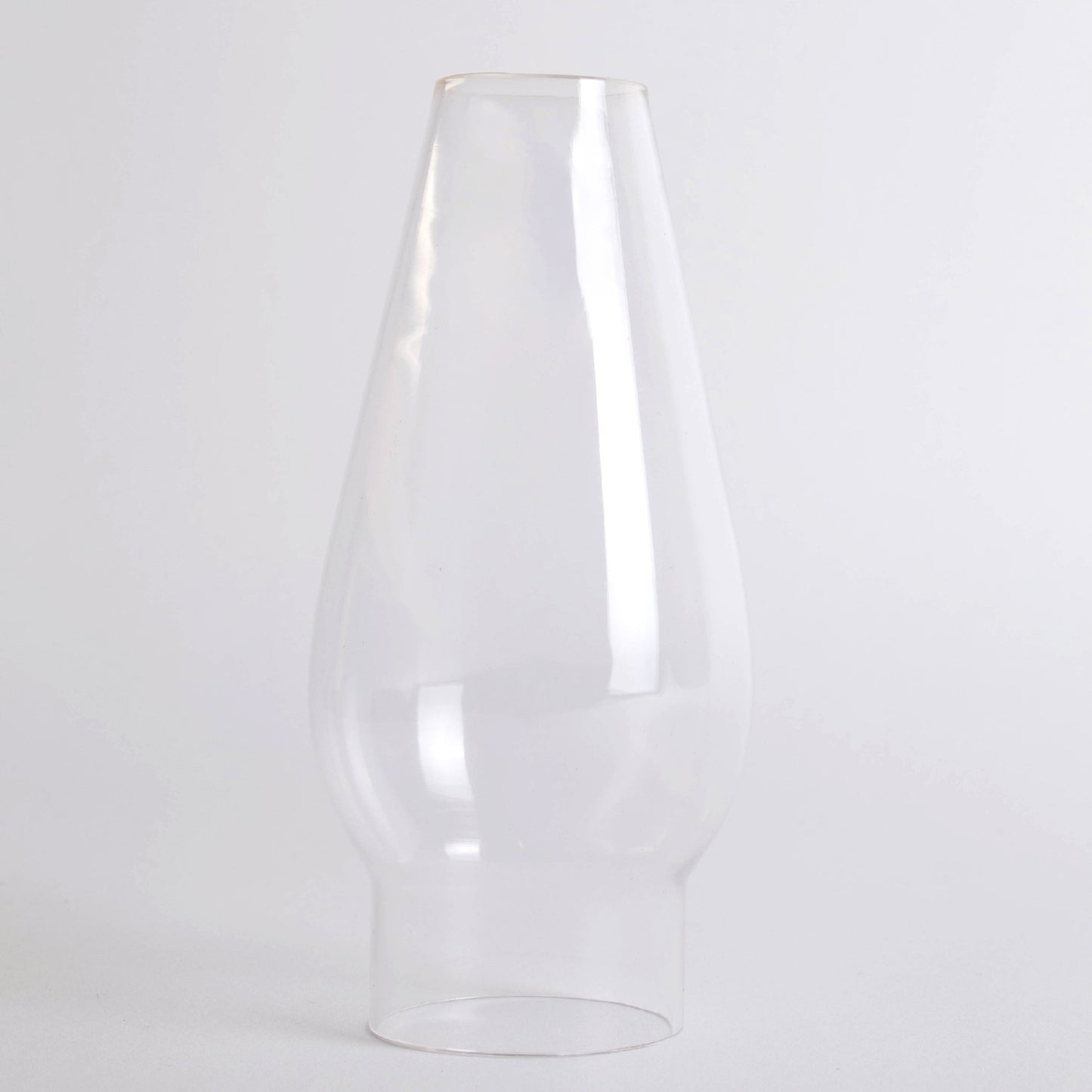 Clear glass oil lamp chimney with a smooth top and tapered design, handcrafted for use in lamps and lighting, parts and accessories, chimneys and globes collections.