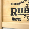Close-up of wooden frame corner with decorative black printed nameplate on a handcrafted galvanized wavy washboard, part of Home & Decor and Laundry Supplies collections made in USA.