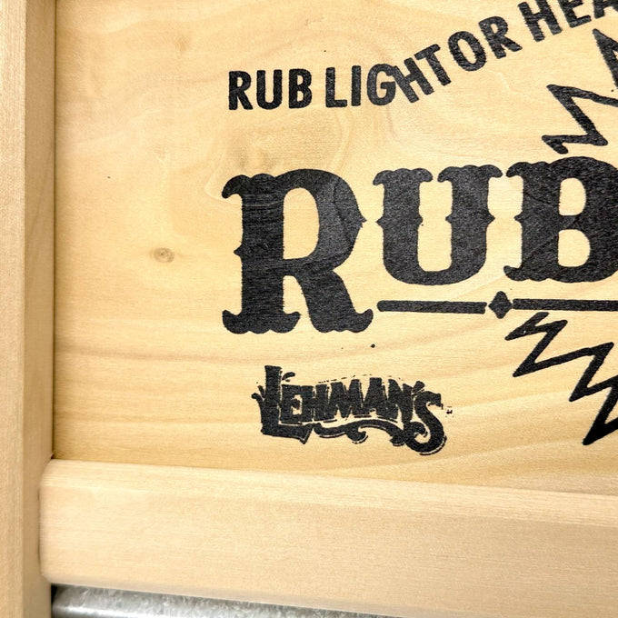 Close-up of wooden frame corner with decorative black printed nameplate on a handcrafted galvanized wavy washboard, part of Home & Decor and Laundry Supplies collections made in USA.
