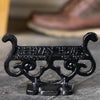 Glossy black cast aluminum boot scraper with vintage scrollwork design, handcrafted by Amish artisans in the USA, perfect for Home & Decor and Household Helpers collections.
