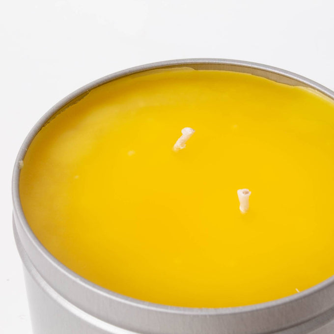Hand-poured bright yellow citronella candle with two wicks in a lightweight metal tin, handcrafted for outdoor use in camping, pest control, and farm, garden & tool collections.