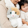 Soft plush cat in calming neutral tones with bright blue eyes, designed for warming comfort, featured in Health & Wellness, Children's Toys, and Indoor Play collections.