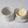 Handcrafted ceramic butter crock with simple blue lines, designed for keeping butter fresh and spreadable without refrigeration, ideal for kitchen, homesteading, and specialty equipment collections.