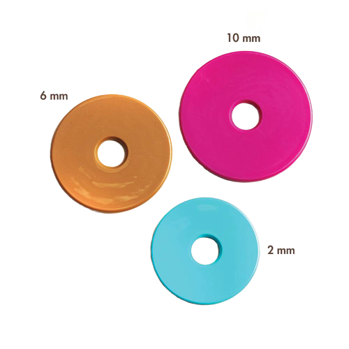 Set of three colorful removable thickness discs in yellow, pink, and blue for adjustable rolling pin, handmade for precise dough rolling in kitchen and baking supplies collections.